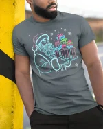 Neon Santa Christmas Gifts Graphic T Shirt Festive Holiday Glow Tee - model wearing grey tee, leaning on column