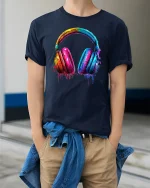 Colorful Paint Splash Headphones Music Lover Artistic Graphic Tee - model wearing navy tee with hands in pockets