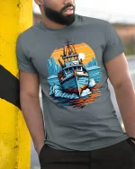 Vintage Fishing Boat Ocean Sunset Graphic T Shirt Nautical Art Tee - model wearing grey tee, leaning on column