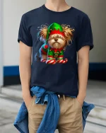 Cute Christmas Elf Dog Graphic Tee With Playful Holiday Charm - model wearing navy tee with hands in pockets