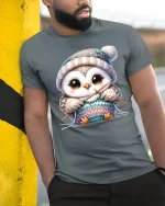 Cute Knitting Owl Wearing Winter Hat Cozy Graphic Tee Tshirt - model wearing grey tee, leaning on column
