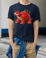 Cute Strawberry Turtle Fantasy Animal Illustration Graphic Tee - model wearing navy tee with hands in pockets