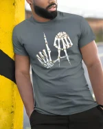 Skeleton Hand Letter Art Dark Humor Graphic Tee Tshirt - model wearing grey tee, leaning on column