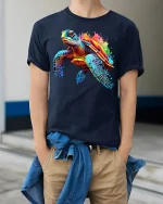 Colorful Sea Turtle Splash Art Graphic T Shirt Ocean Style Tee - model wearing navy tee with hands in pockets