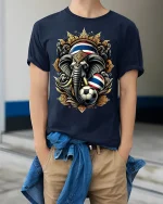 Thailand Elephant Soccer Graphic Tshirt With Royal Power Art Style - model wearing navy tee with hands in pockets