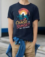 Chase The Sunset Not The Hours Inspirational Adventure Graphic Tshirt - model wearing navy tee with hands in pockets