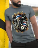 Thailand Elephant Soccer Graphic Tshirt With Royal Power Art Style - model wearing grey tee, leaning on column