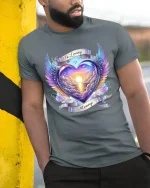 In Loving Memory Angel Wing Heart Sunset Art Tshirt Emotional Design - model wearing grey tee, leaning on column