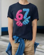 Funny 67 Donut Style T Shirt With Dripping Candy Art Design - model wearing navy tee with hands in pockets