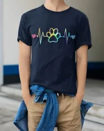 Rainbow Heartbeat Paw Print Love Graphic T Shirt - model wearing navy tee with hands in pockets