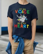 Im His Voice He Is My Heart Autism Awareness Graphic T Shirt - model wearing navy tee with hands in pockets