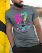 67 Neon Donut Hockey T Shirt With Funny Melting Ice Style - model wearing grey tee, leaning on column