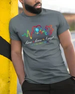 Live Love Accept Autism Awareness T Shirt With Colorful Heartbeat - model wearing grey tee, leaning on column