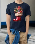 Festive Christmas Gift Boot T-Shirt for Holiday Cheer Lovers - model wearing navy tee with hands in pockets