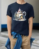 Cozy Teapot Cottage Christmas Tee with Snowy Holiday Scene - model wearing navy tee with hands in pockets