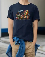 Christmas Gift Train Tee with Colorful Holiday Locomotive Art - model wearing navy tee with hands in pockets