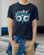 Funny Lurk Eyeball Graphic T-Shirt for Playful Street Style - model wearing navy tee with hands in pockets