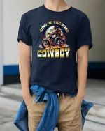 King of the Road Cowboy Motorcycle T-Shirt with Bold Design - model wearing navy tee with hands in pockets