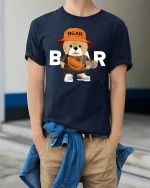 Cool Skater Bear Tee with Streetwear Style and Cute Bear Graphic - model wearing navy tee with hands in pockets