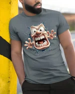 Crazy Cartoon Face Tee with Wild Screaming Character Art - model wearing grey tee, leaning on column