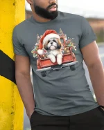 Christmas Puppy Truck Tee with Cute Santa Dog Holiday Art - model wearing grey tee, leaning on column