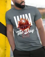 Win The Day Basketball Tee with Fiery Hoop Game Graphic - model wearing grey tee, leaning on column