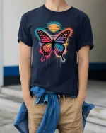 Colorful Butterfly Sunset Splash Artistic Graphic T-Shirt - model wearing navy tee with hands in pockets