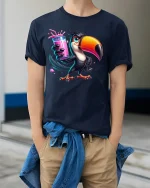 Funny Toucan With Pink Drink Tropical Vibes Graphic T-Shirt - model wearing navy tee with hands in pockets