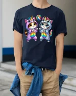 Cute Unicorn Cat Duo Rainbow Playtime Kawaii T-Shirt - model wearing navy tee with hands in pockets