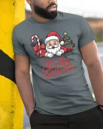 Cute Santa Tis the Season Christmas Cheer Graphic T-Shirt - model wearing grey tee, leaning on column