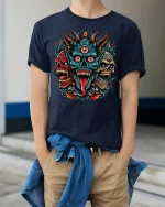 Three Eyed Demon Skull Tee Fierce Tribal Horror Artwork - model wearing navy tee with hands in pockets