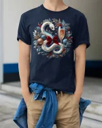 Elegant Holiday Snake Wreath Champagne Celebration Tee - model wearing navy tee with hands in pockets