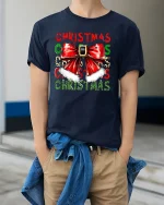 Christmas Bow Santa Belt Festive Holiday Graphic T-Shirt - model wearing navy tee with hands in pockets