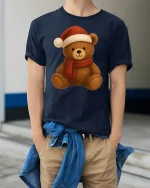 Cute Christmas Teddy Bear Santa Hat Holiday Cartoon Graphic Tee - model wearing navy tee with hands in pockets