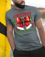 Christmas Bow Santa Belt Festive Holiday Graphic T-Shirt - model wearing grey tee, leaning on column