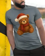 Cute Christmas Teddy Bear Santa Hat Holiday Cartoon Graphic Tee - model wearing grey tee, leaning on column