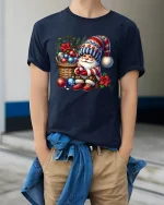 Cozy Christmas Gnome With Ornaments Basket Festive Holiday Tee - model wearing navy tee with hands in pockets