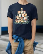 Cute Christmas Cat Tree Santa Hat Holiday Lights Graphic Tee - model wearing navy tee with hands in pockets