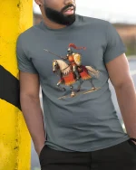 Gallant Knight on Horseback Tee with Bold Medieval Warrior Art - model wearing grey tee, leaning on column