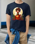 Cute Christmas Elf Sitting On Ornament Festive Graphic Tee - model wearing navy tee with hands in pockets