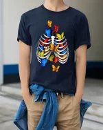 Colorful Butterflies Rib Cage Surreal Graphic Tee - model wearing navy tee with hands in pockets