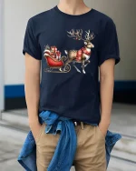 Christmas Reindeer Sleigh Art T Shirt Festive Holiday Magic Tee - model wearing navy tee with hands in pockets
