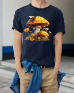 Mushroom Bee Nature Art Graphic Tee Whimsical Forest T Shirt - model wearing navy tee with hands in pockets