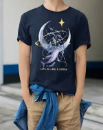 Life Is Like A Coffee Moon And Whale Dream Graphic T Shirt - model wearing navy tee with hands in pockets