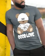 Cute Teddy Bear Good Love Graphic T Shirt With Soft Sweet Style - model wearing grey tee, leaning on column