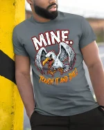 Mine Touch It And Die Angry Eagle Warning Graphic T Shirt - model wearing grey tee, leaning on column