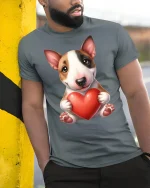Cute Puppy Love Graphic Tee Adorable Dog Holding Heart Art - model wearing grey tee, leaning on column
