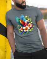 Colorful Tropical Parrot With Flowers Vibrant Art Tee - model wearing grey tee, leaning on column