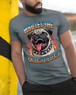 Who Let The Dog Unleash The Beast Funny Bulldog Graphic Tee - model wearing grey tee, leaning on column