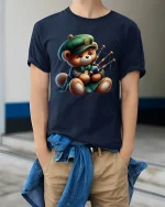 Cute Bagpipe Playing Teddy Bear Graphic Tee With Cozy Charm - model wearing navy tee with hands in pockets